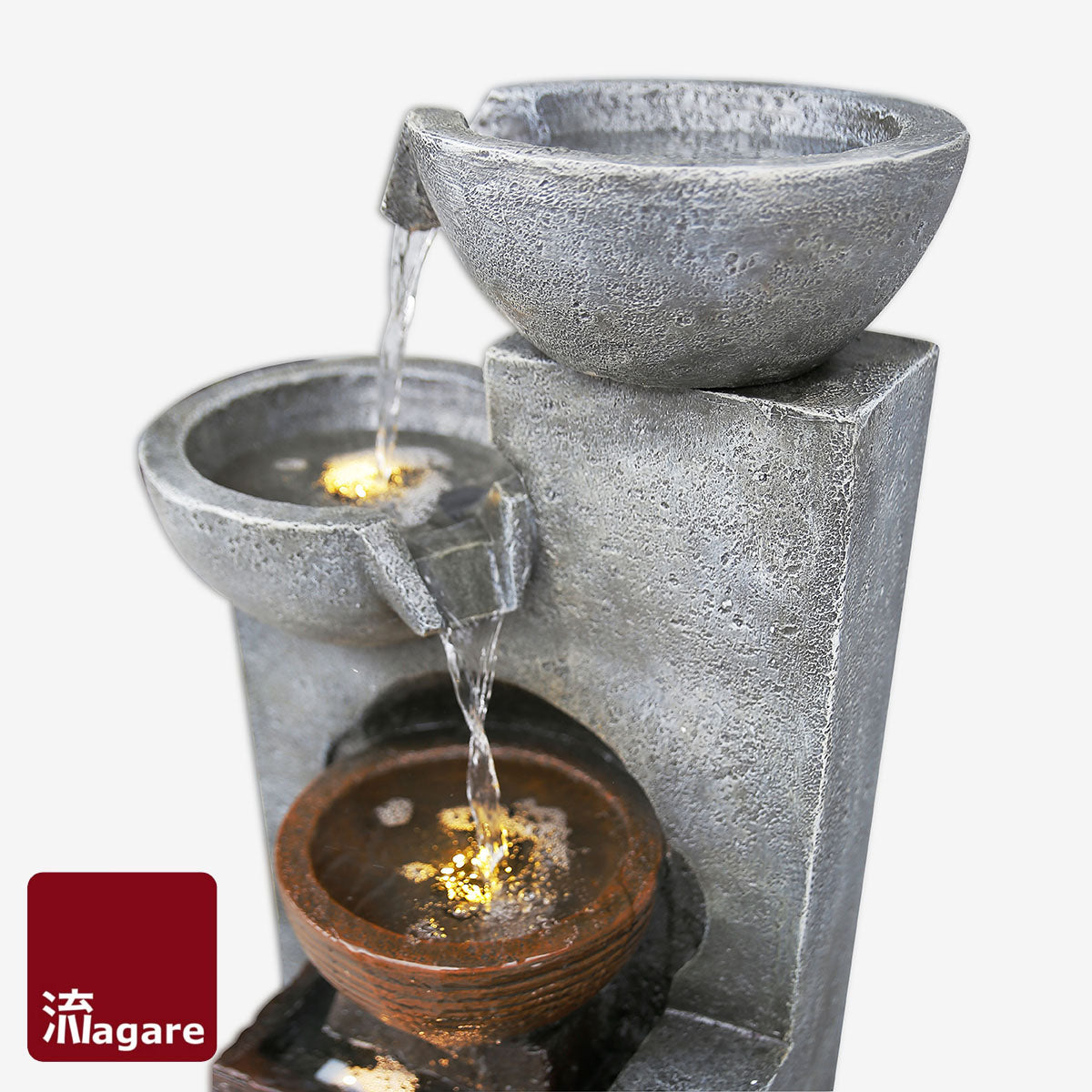 Awe your guests with this impressive floor standing unit that is a true reflection of grace and sophistication. A golden copper centre encased in grey polished stone finish with 3 alternating bowls of cascading waters.