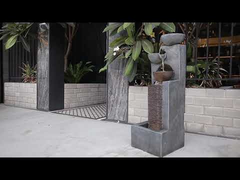 Awe your guests with this impressive floor standing unit that is a true reflection of grace and sophistication. A golden copper centre encased in grey polished stone finish with 3 alternating bowls of cascading waters.